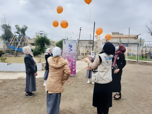 girls flying baloons